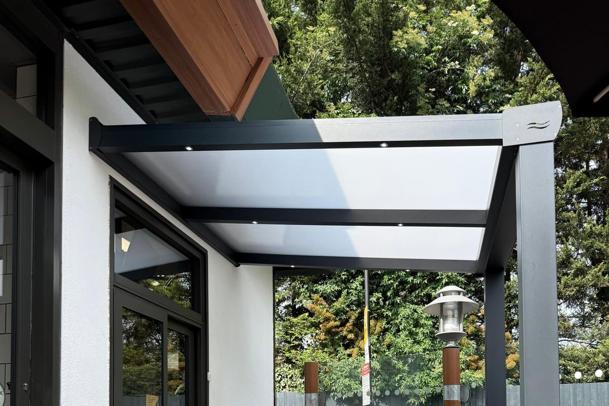 Dedicated collection shelter with stainless staging shelf at a commercial venue.