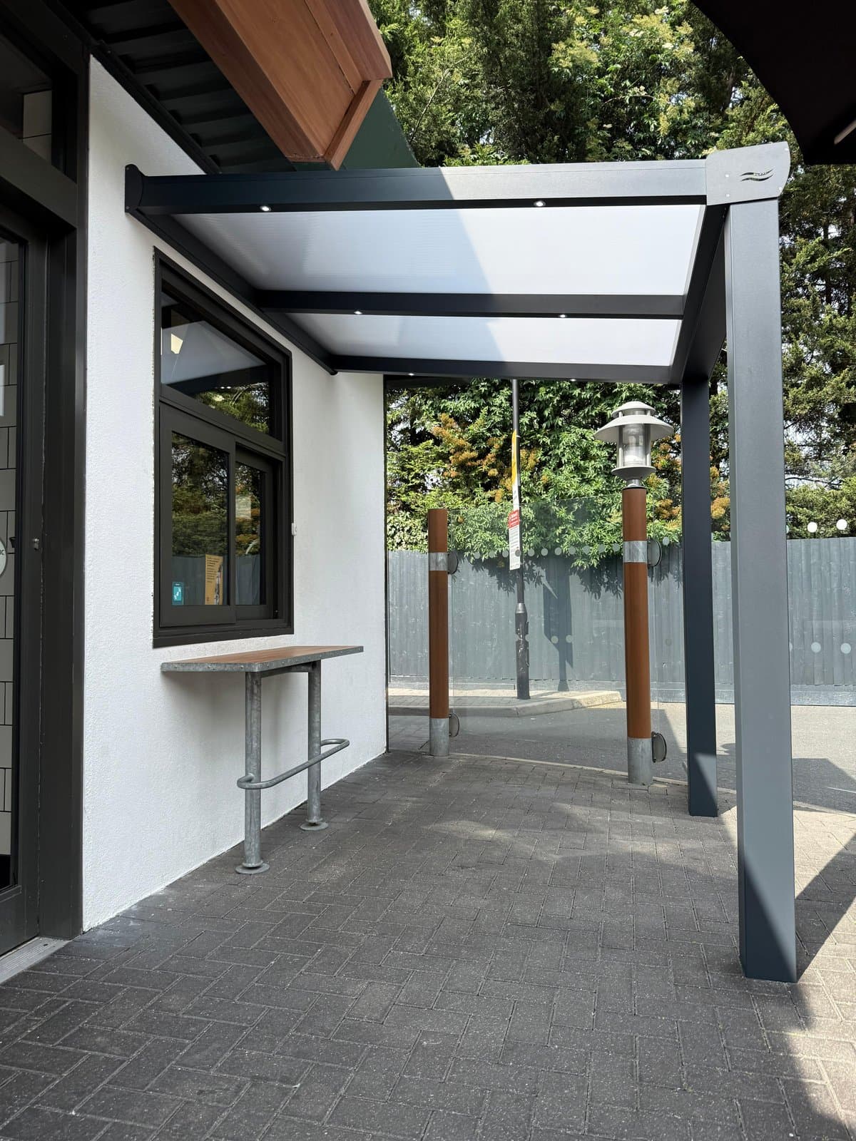 McDonald's veranda shelter with corner post for delivery drivers to collect food in Stanmore London.
